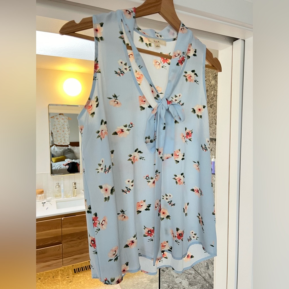 Pretty baby blue sleeveless blouse